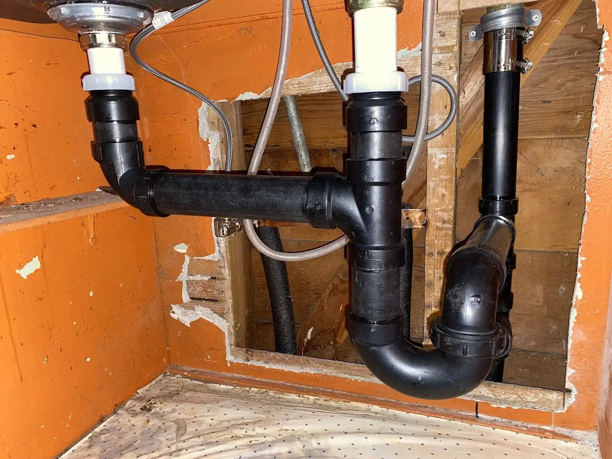 Professional Garbage Disposal Repair equipment and tools on the job in Benton